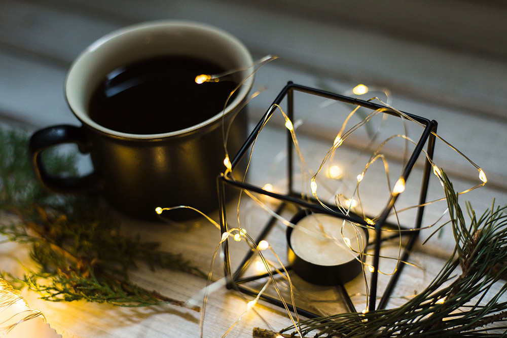 Christmas decor. Cup of coffee and candle